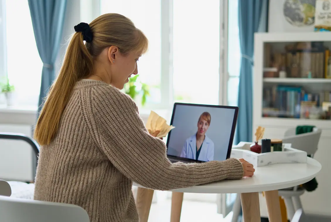 Woman having a video call with doctor.