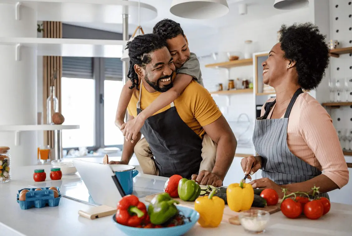 Family cooking together in modern kitchen.