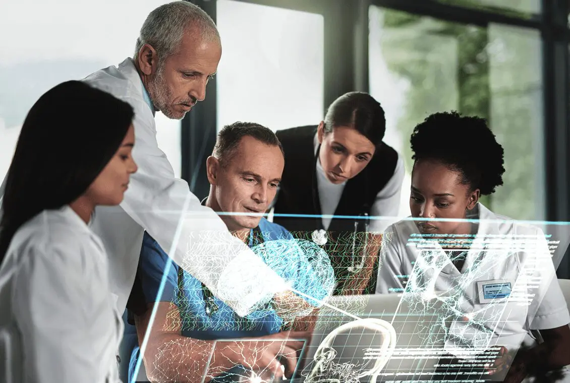 Doctors collaborating over digital medical interface.